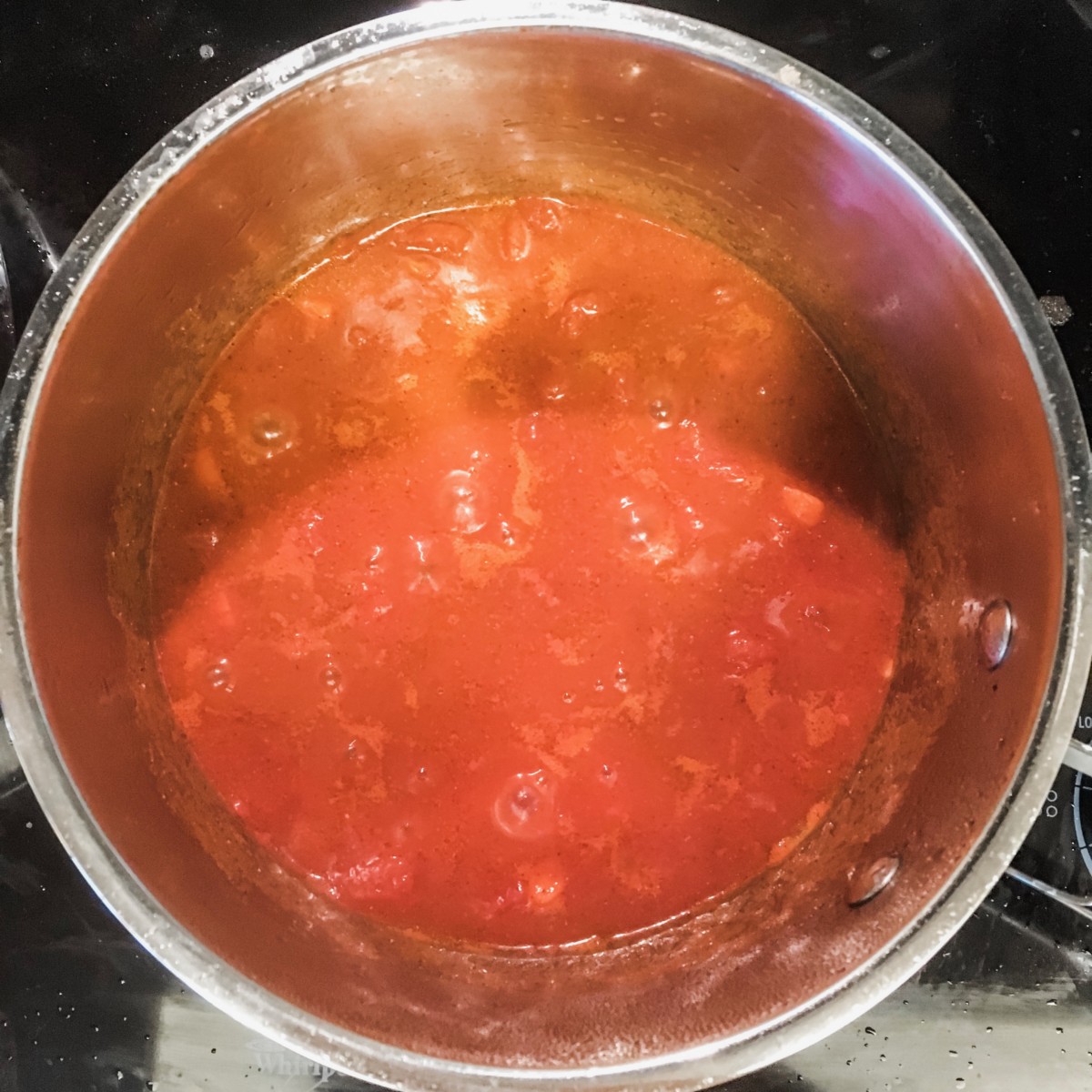 simmering tomato sauce
