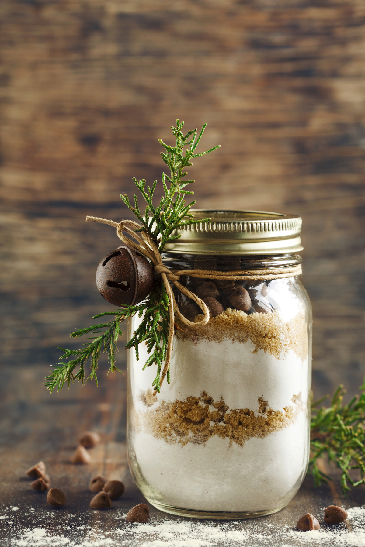 a mason jar filled with cookie baking mix on a table